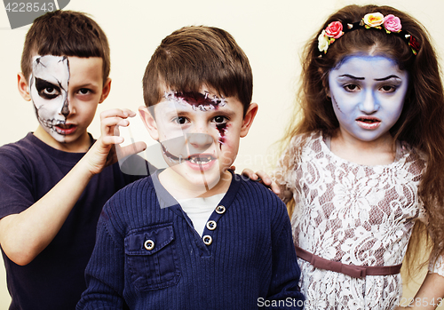 Image of zombie apocalypse kids concept. Birthday party celebration facepaint on children dead bride, scar face, skeleton together having fun