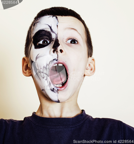 Image of little cute boy with facepaint like skeleton to celebrate halloween, lifestyle people concept, children on holiday 