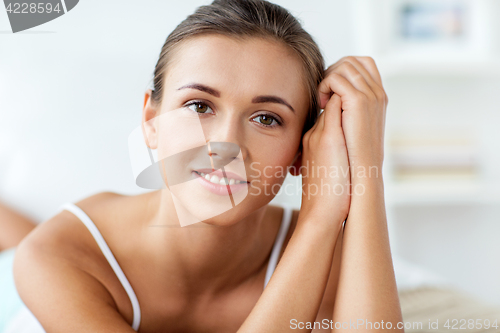 Image of close up of beautiful happy young woman at home