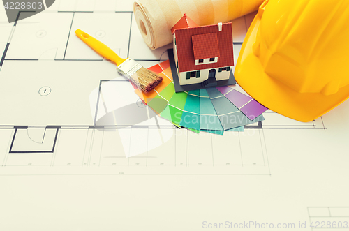 Image of close up of house blueprint with building tools