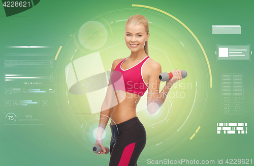 Image of happy sporty woman with dumbbells flexing biceps