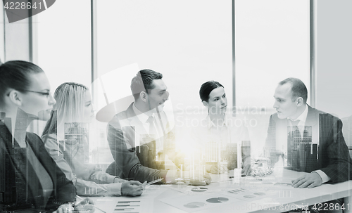 Image of smiling business team at office meeting