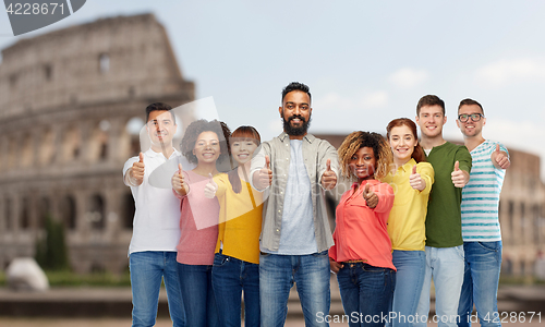 Image of happy people showing thumbs up over coliseum