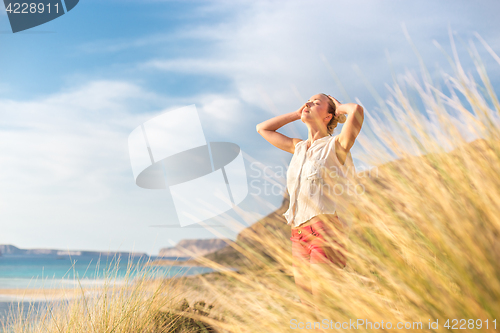 Image of Free Happy Woman Enjoying Sun on Vacations.