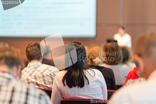 Image of Speaker giving presentation on business conference.