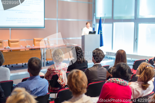 Image of Speaker giving presentation on business conference.