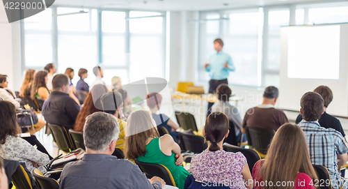 Image of Speaker giving presentation on business conference.