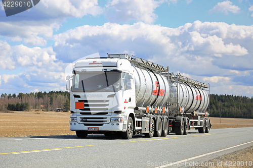 Image of White Scania Liquid Tanker Trucking on Beautiful Day