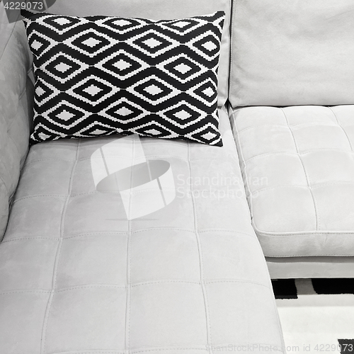 Image of White elegant sofa with decorative cushion