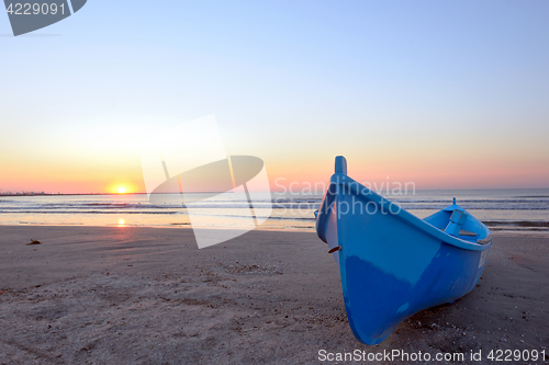 Image of Fishing boat and sunrise 