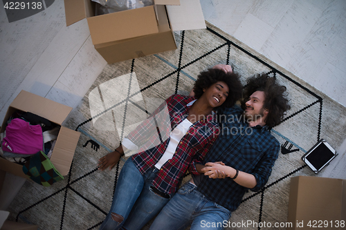 Image of Top view of attractive young multiethnic couple