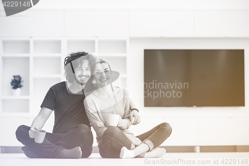 Image of young couple in their new home