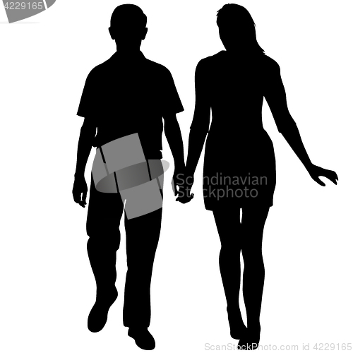 Image of Silhouette man and woman walking hand in hand