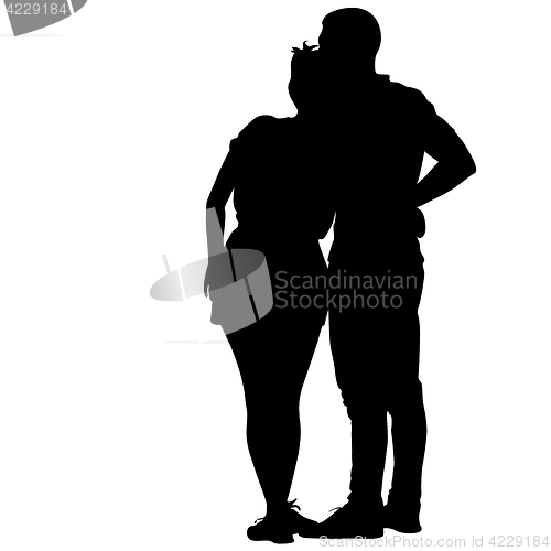 Image of Silhouette man and woman walking hand in hand