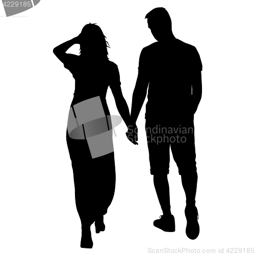 Image of Silhouette man and woman walking hand in hand
