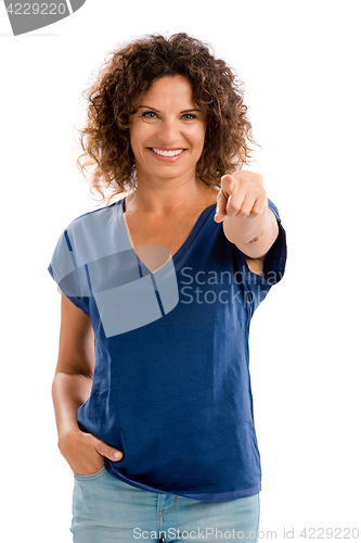 Image of Happy mature woman pointing