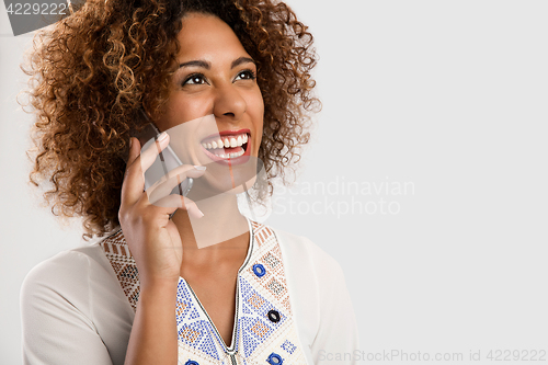 Image of Woman talking on the phone