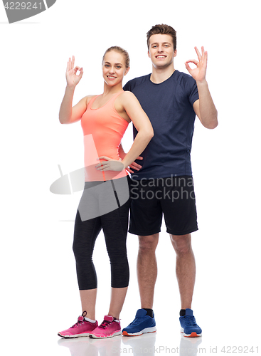 Image of happy sportive man and woman