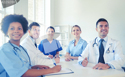 Image of group of happy doctors meeting at hospital office