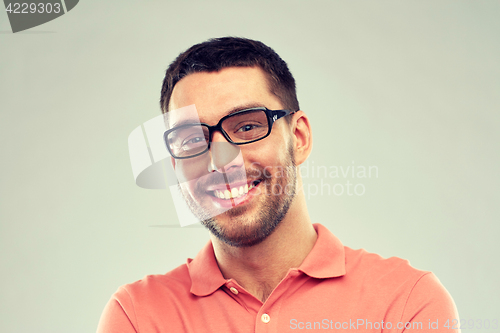 Image of portrait of happy smiling man in eyeglasses