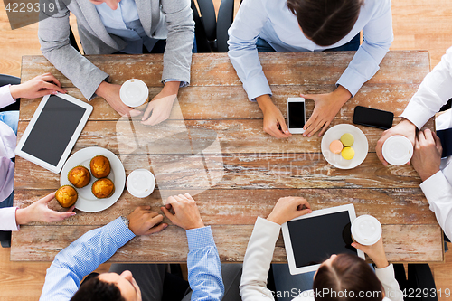 Image of businesspeople with smartphones and tablet pc