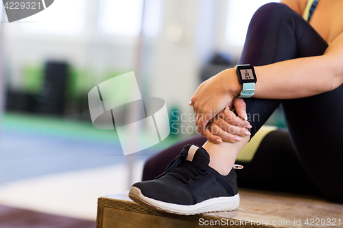 Image of close up of woman with heart rate tracker in gym