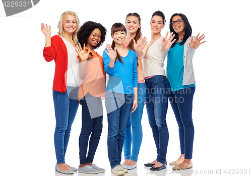 Image of international group of happy women waving hands
