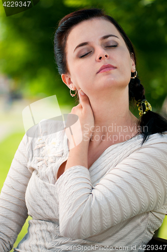 Image of Business woman in summer park