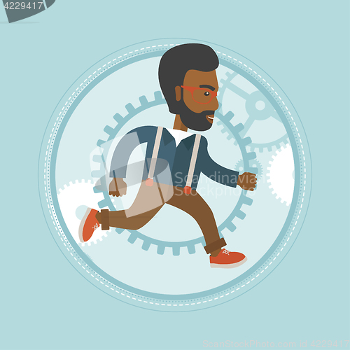 Image of Businessman running on gear background.