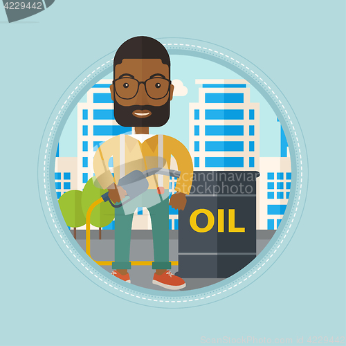 Image of Man with oil barrel and gas pump nozzle.