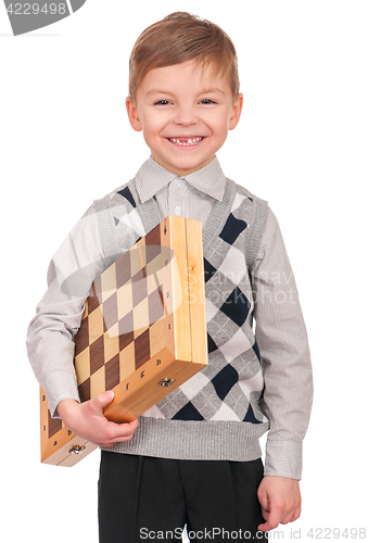 Image of Little boy with chessboard