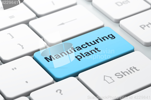 Image of Manufacuring concept: Manufacturing Plant on computer keyboard background