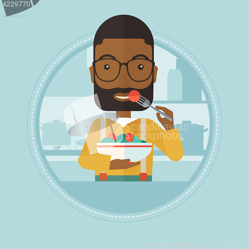 Image of Man eating healthy vegetable salad.