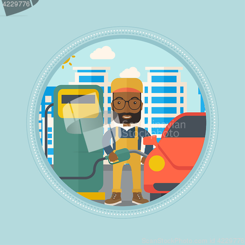 Image of Worker filling up fuel into car.