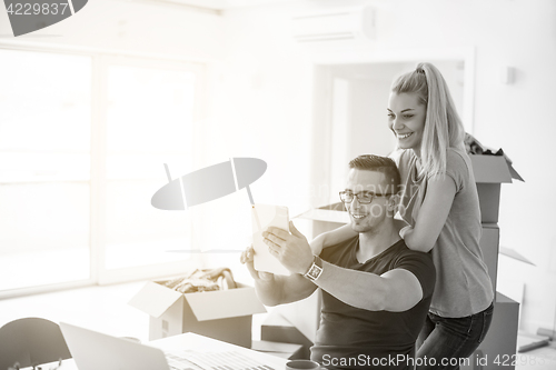 Image of Young couple moving in a new home