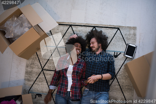 Image of Top view of attractive young multiethnic couple