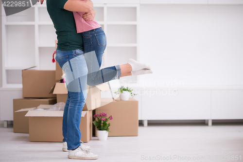 Image of happy Young couple moving in new house