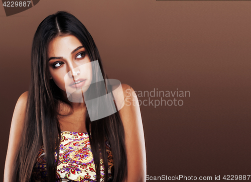 Image of cute happy young indian woman in studio close up smiling, fashion mulatto