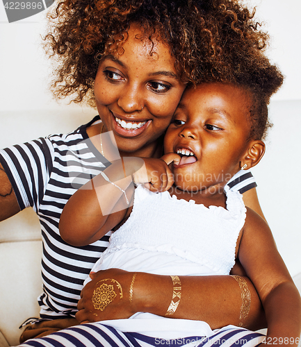 Image of adorable sweet young afro-american mother with cute little daugh