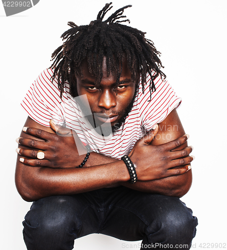 Image of young handsome african american boy singing emotional with microphone isolated on white background, in motion gesturing 