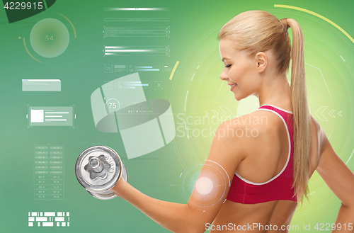 Image of happy sporty woman with dumbbells flexing biceps