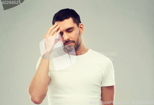 Image of young man suffering from headache