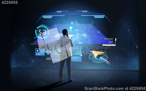 Image of businessman looking at gps navigator map over dark