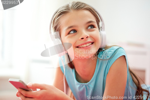 Image of close up of girl with smartphone and headphones