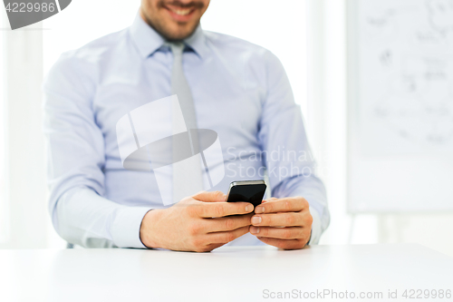 Image of close up of businessman with smartphone
