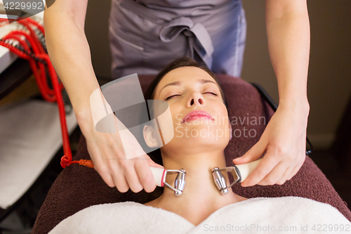 Image of woman having hydradermie facial treatment in spa