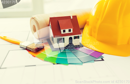 Image of close up of house blueprint with building tools