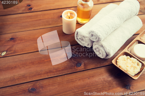 Image of close up of natural cosmetics and bath towels