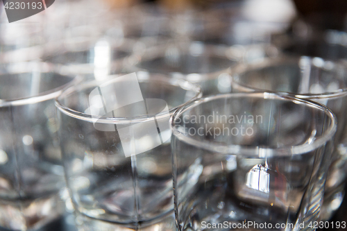 Image of empty old-fashioned glasses at bar