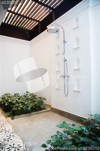 Image of outdoor shower at exotic hotel